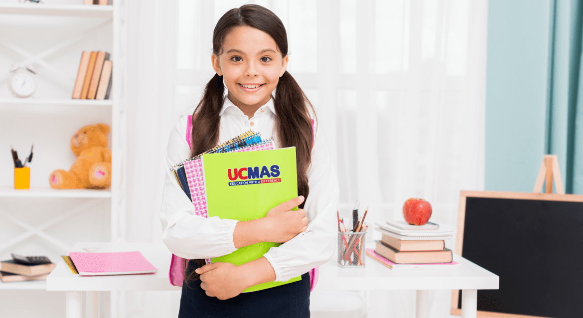 cute schoolgirl uniform holding notepads classroom