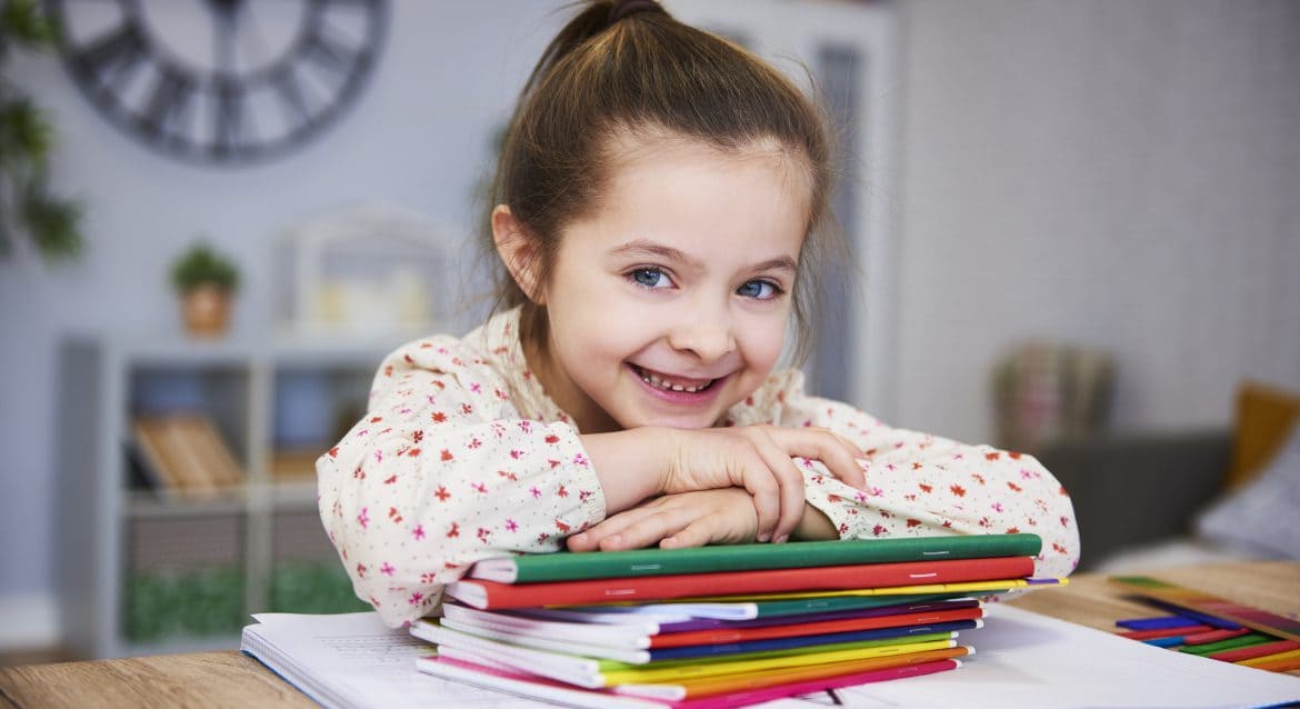 smiling girl studying home