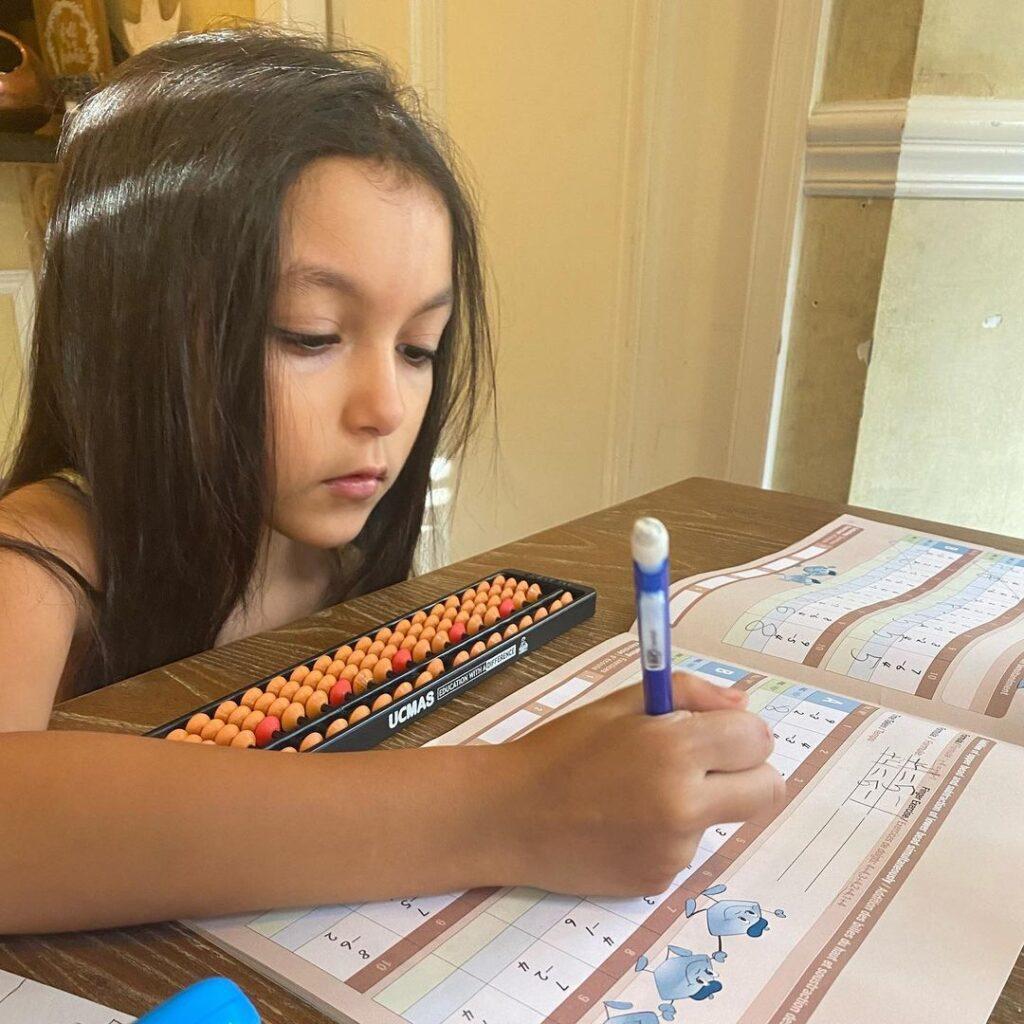 A UCMAS Student learning abacus math at home.