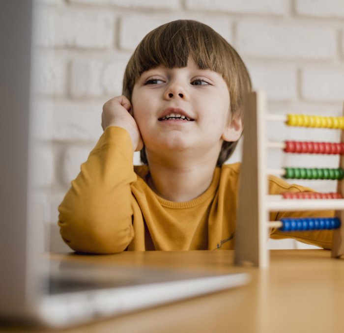 front-view-child-desk-with-laptop-abacus